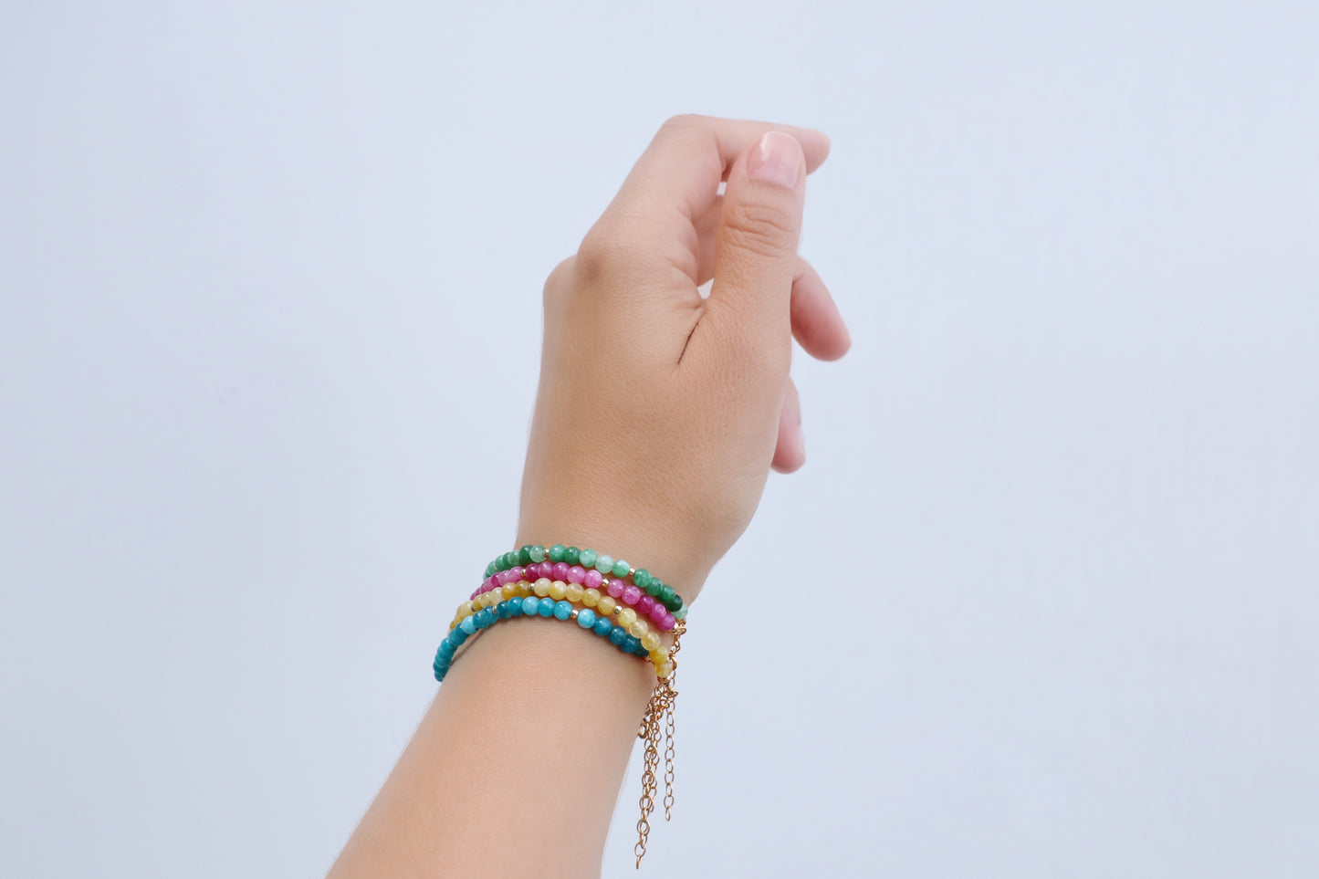 Four Tourmaline bracelet with round beads, one in each colour: green, pink, yellow and blue.