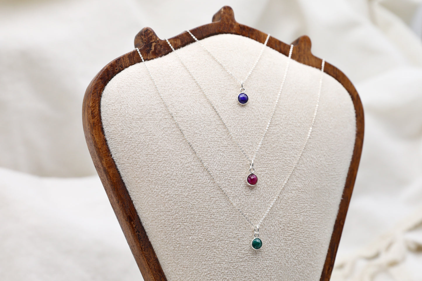 Three Sterling Silver Dainty Necklaces with small Sapphire, Ruby and Emerald charms.