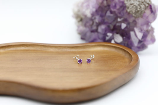 Pair of Amethyst stud earrings in Sterling Silver.
Size: 4mm