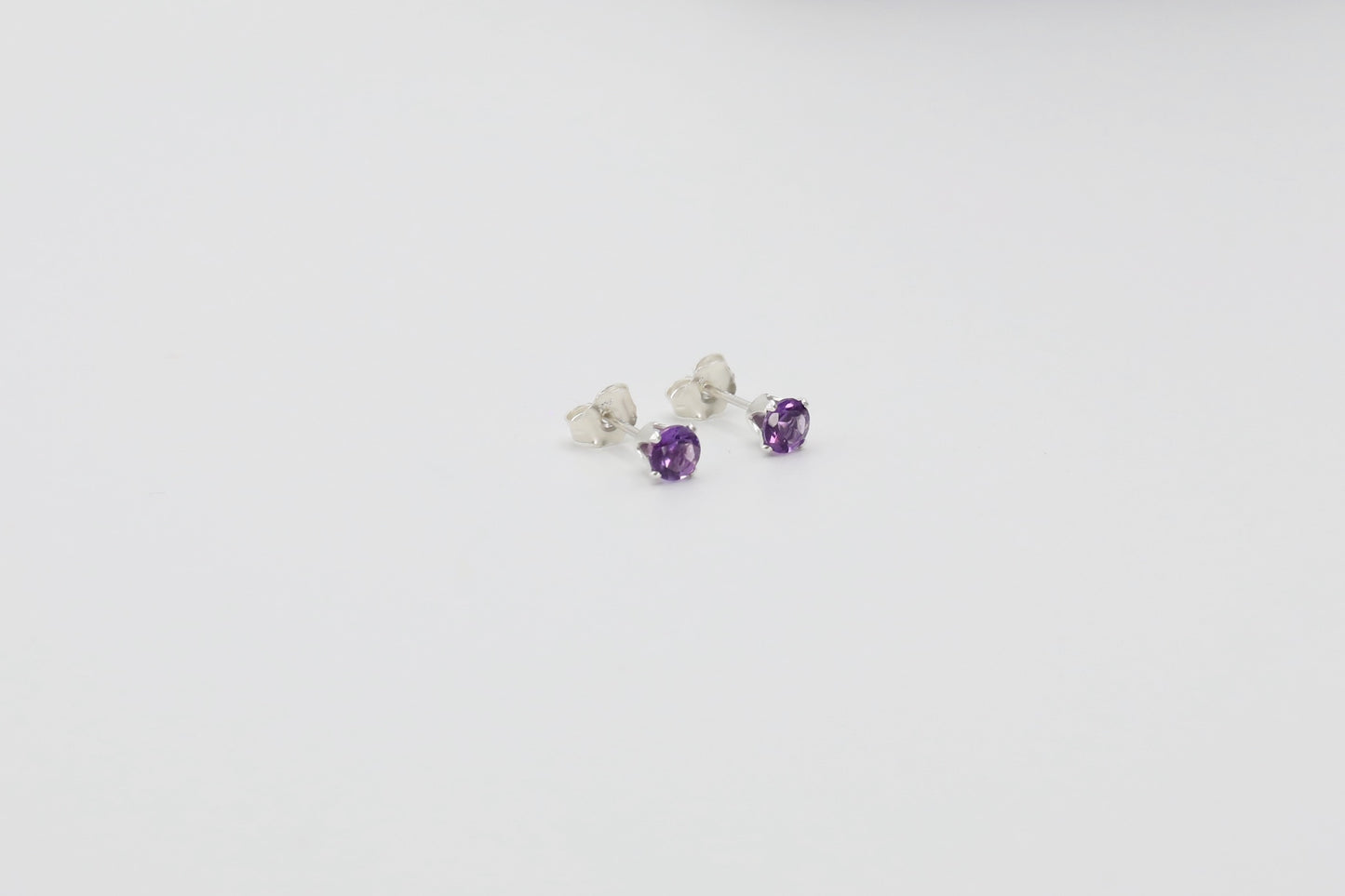 Pair of Amethyst stud earrings in Sterling Silver.
Size: 4mm