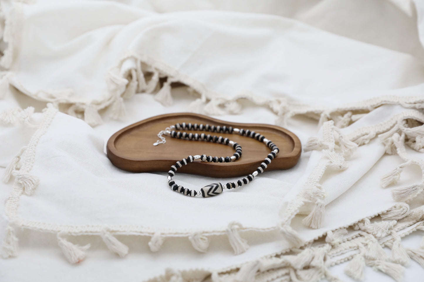 The Ancient Wisdom Necklace by Gaia's Heirlooms, made with black and white Tibetan Agates and Sterling Silver.