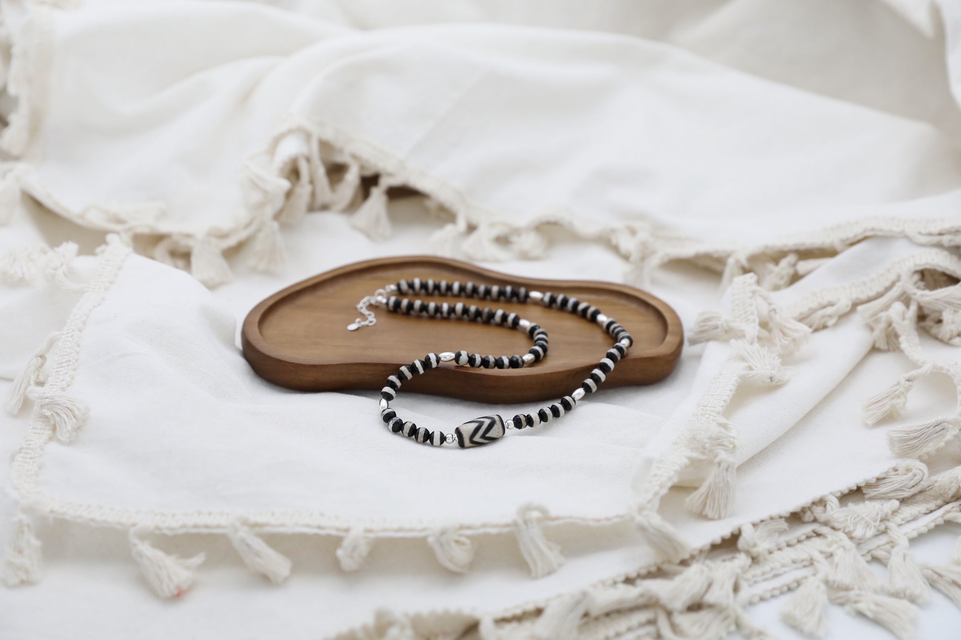 The Ancient Wisdom Necklace by Gaia's Heirlooms, made with black and white Tibetan Agates and Sterling Silver.