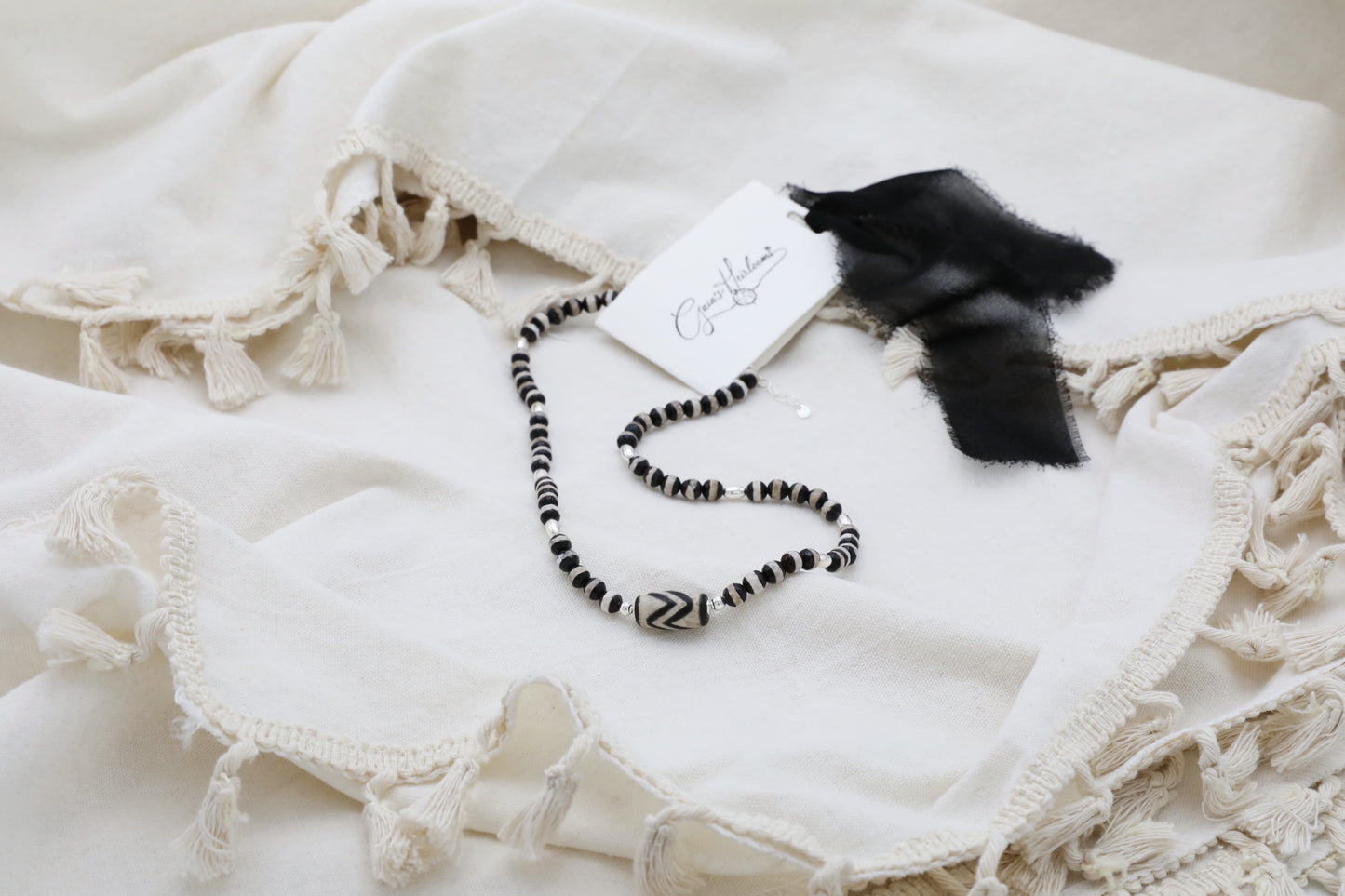 The Ancient Wisdom Necklace by Gaia's Heirlooms, made with black and white Tibetan Agates and Sterling Silver.
