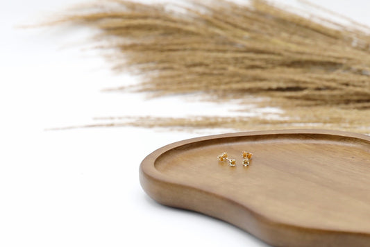 Pair of Citrine stud earrings in Gold Filled. Size: 3mm