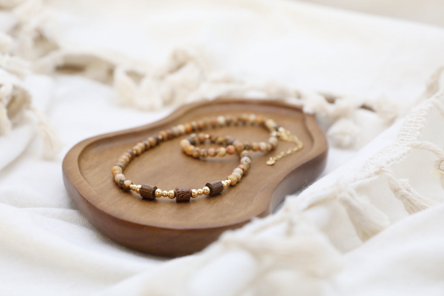 The Earth's Story Necklace by Gaia's Heirlooms, made with Picture Jasper beads, natural wood and Gold Filled details.