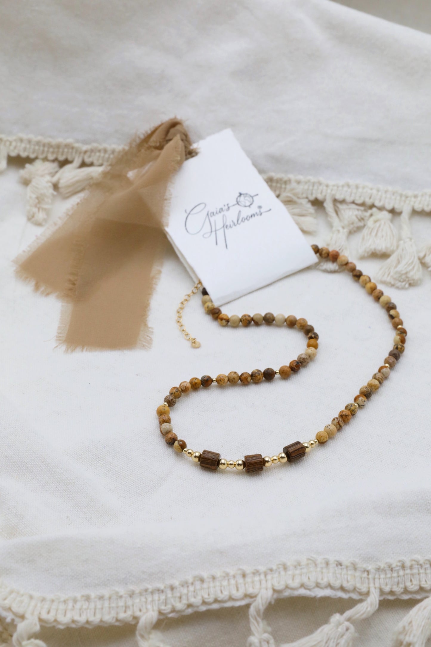 The Earth's Story Necklace by Gaia's Heirlooms, made with Picture Jasper beads, natural wood and Gold Filled details.