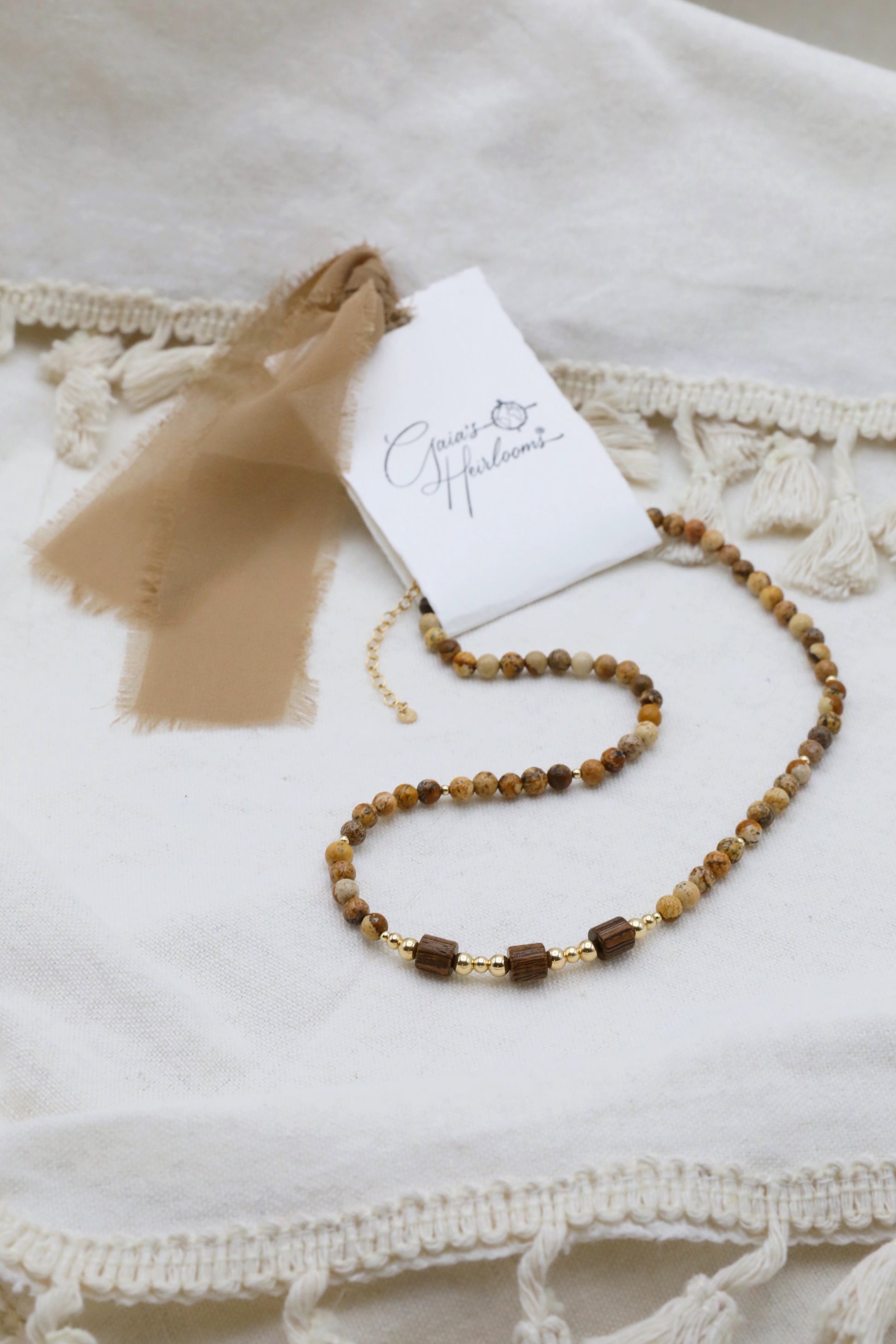 The Earth's Story Necklace by Gaia's Heirlooms, made with Picture Jasper beads, natural wood and Gold Filled details.