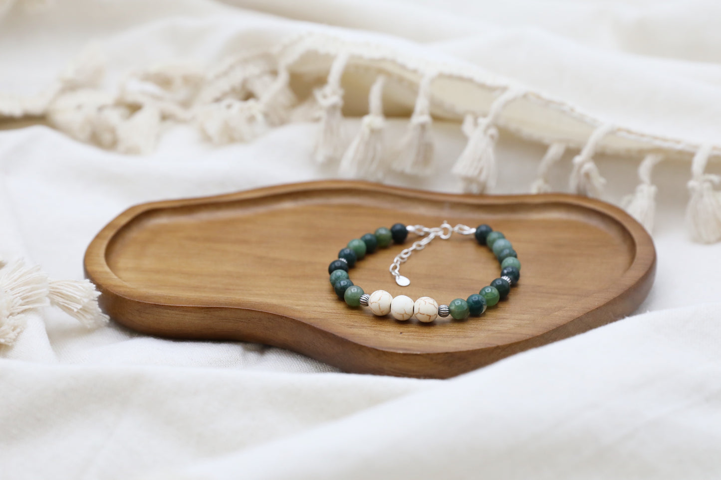 The Forest Floor Bracelet by Gaia's Heirlooms, made with Moss Agate and three Howlite beads, finished with oxidised Sterling Silver details.
