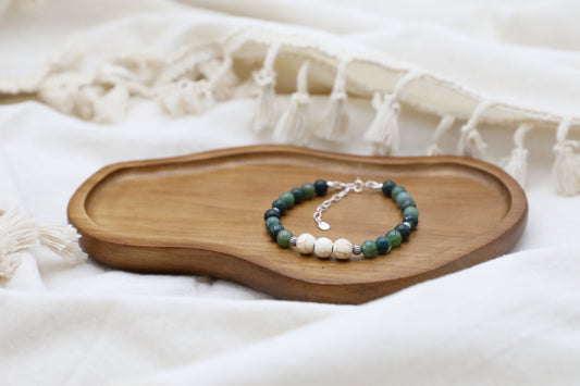 The Forest Floor Bracelet by Gaia's Heirlooms, made with Moss Agate and three Howlite beads, finished with oxidised Sterling Silver details.