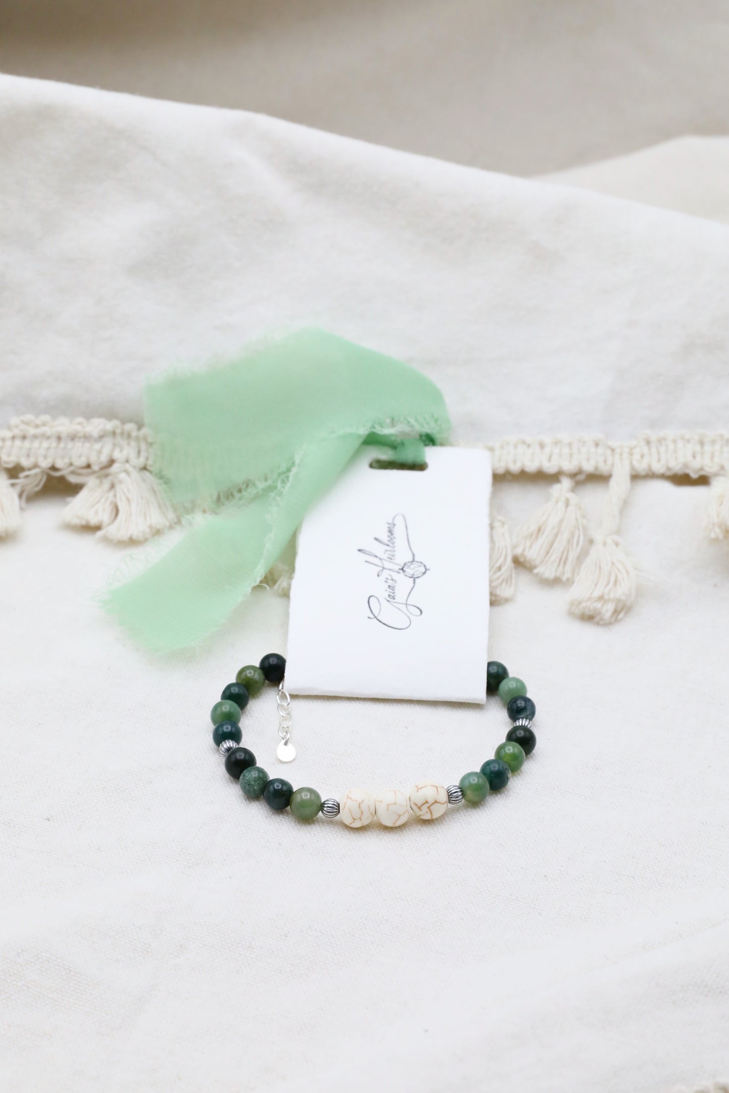 The Forest Floor Bracelet by Gaia's Heirlooms, made with Moss Agate and three Howlite beads, finished with oxidised Sterling Silver details.