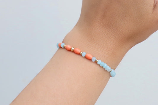 Bracelet handmade with Amazonines, salmon-coloured Bamboo Corals and Gold Filled details.