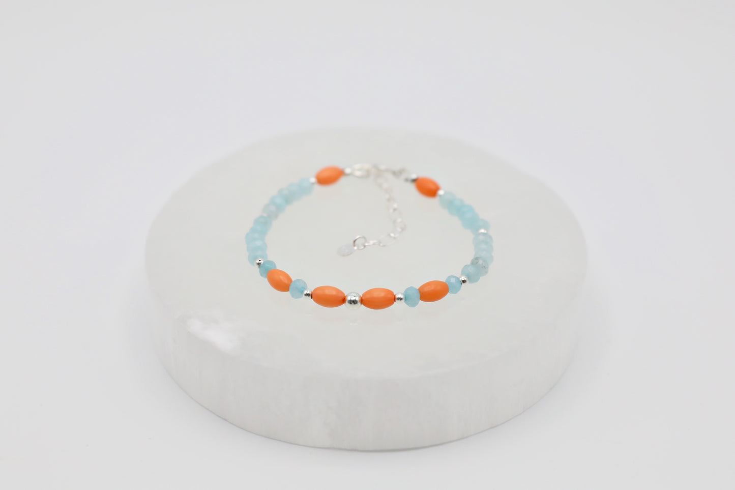 Bracelet handmade with Amazonines, salmon-coloured Bamboo Corals and Sterling Silver details.