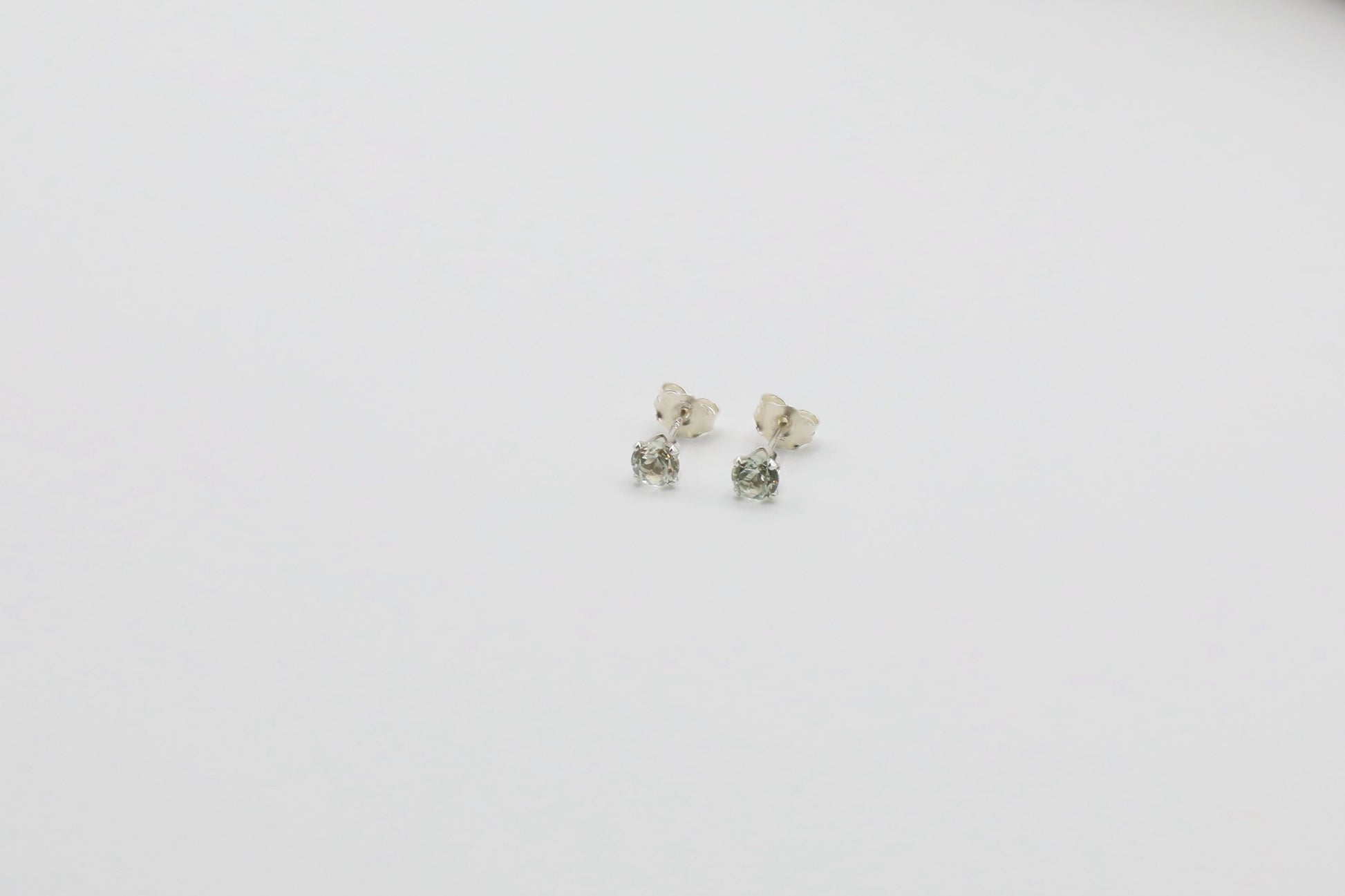 Pair of Light Green Amethyst stud earrings in Sterling Silver.
Size: 4mm