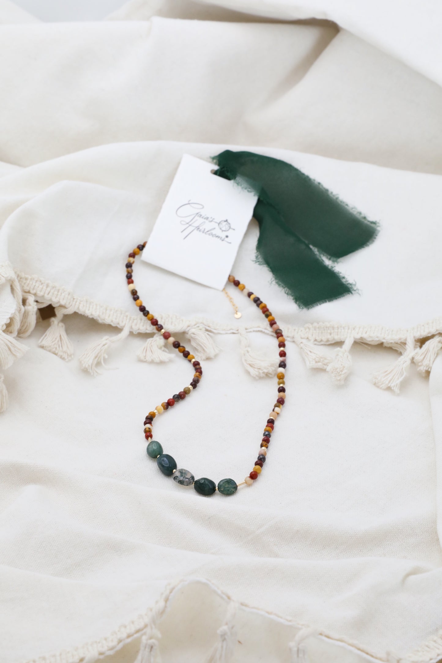 The Resilient Heart Necklace by Gaia's Heirlooms, made with Mookaite beads, Moss Agates and Gold Filled details.