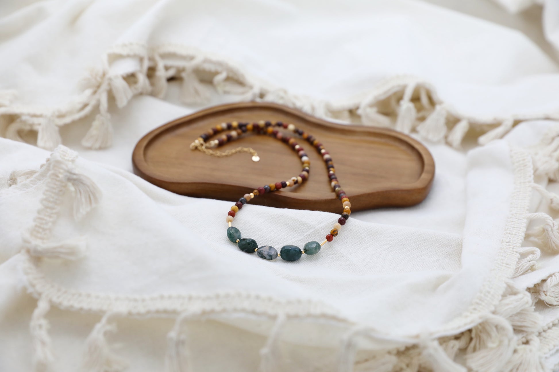 The Resilient Heart Necklace by Gaia's Heirlooms, made with Mookaite beads, Moss Agates and Gold Filled details.