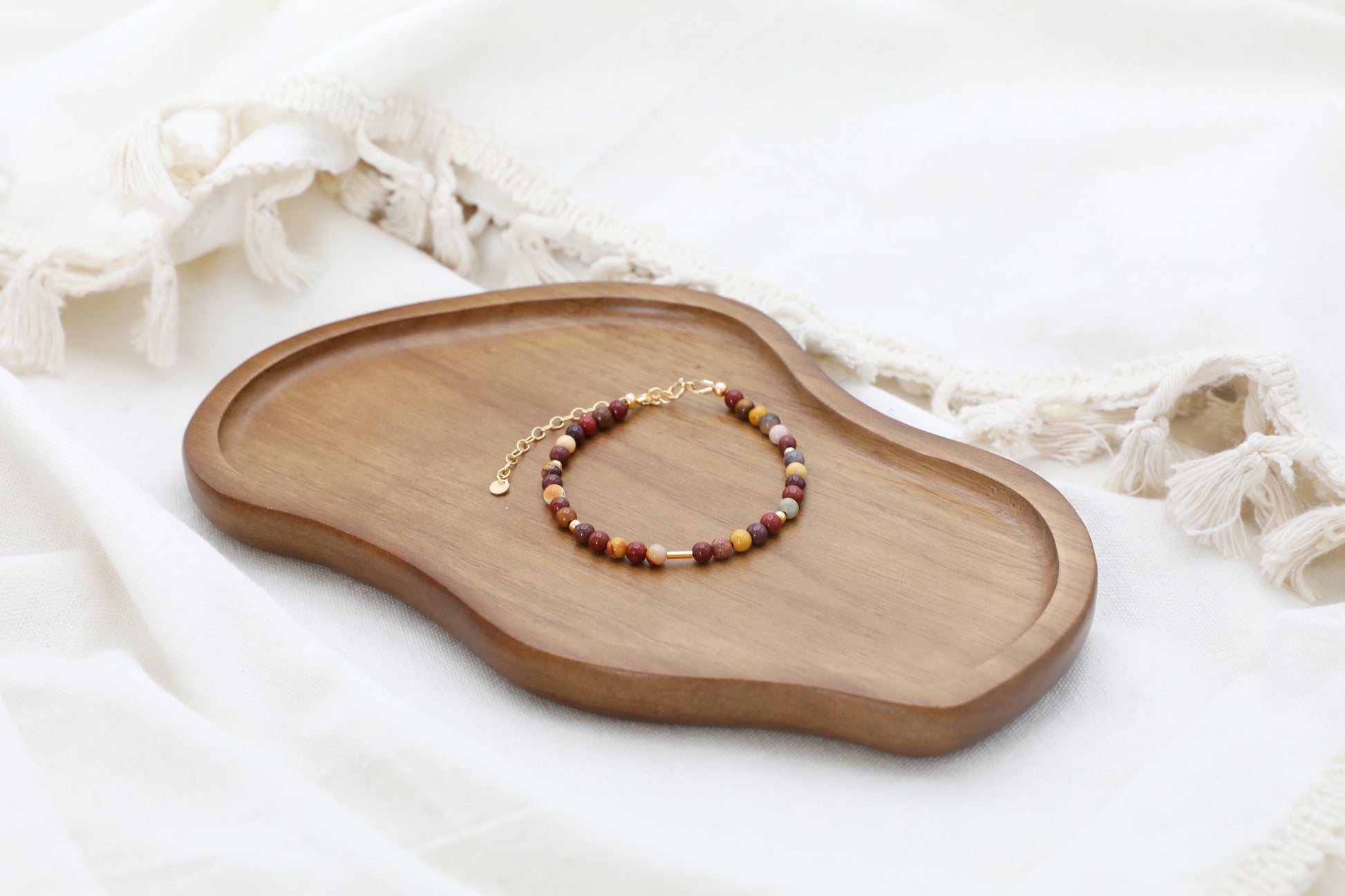 The Resilient Heart Bracelet by Gaia's Heirlooms, made with Mookaite beads and Gold Filled details.