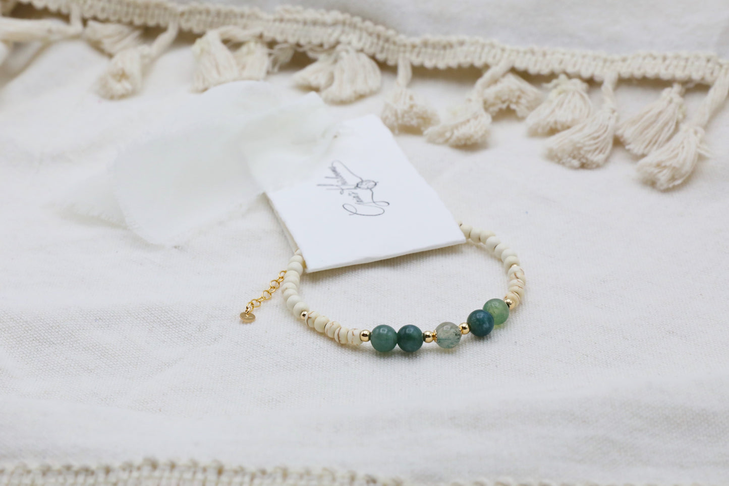 The Stillness Bracelet by Gaia's Heirlooms, made with Howlite and Moss Agate beads, finished with Gold Filled details.