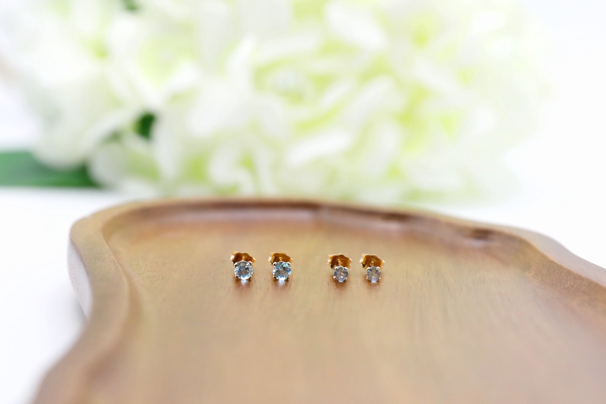 Gold Filled Swiss Blue Topaz studs in 4mm and 4mm side by size.