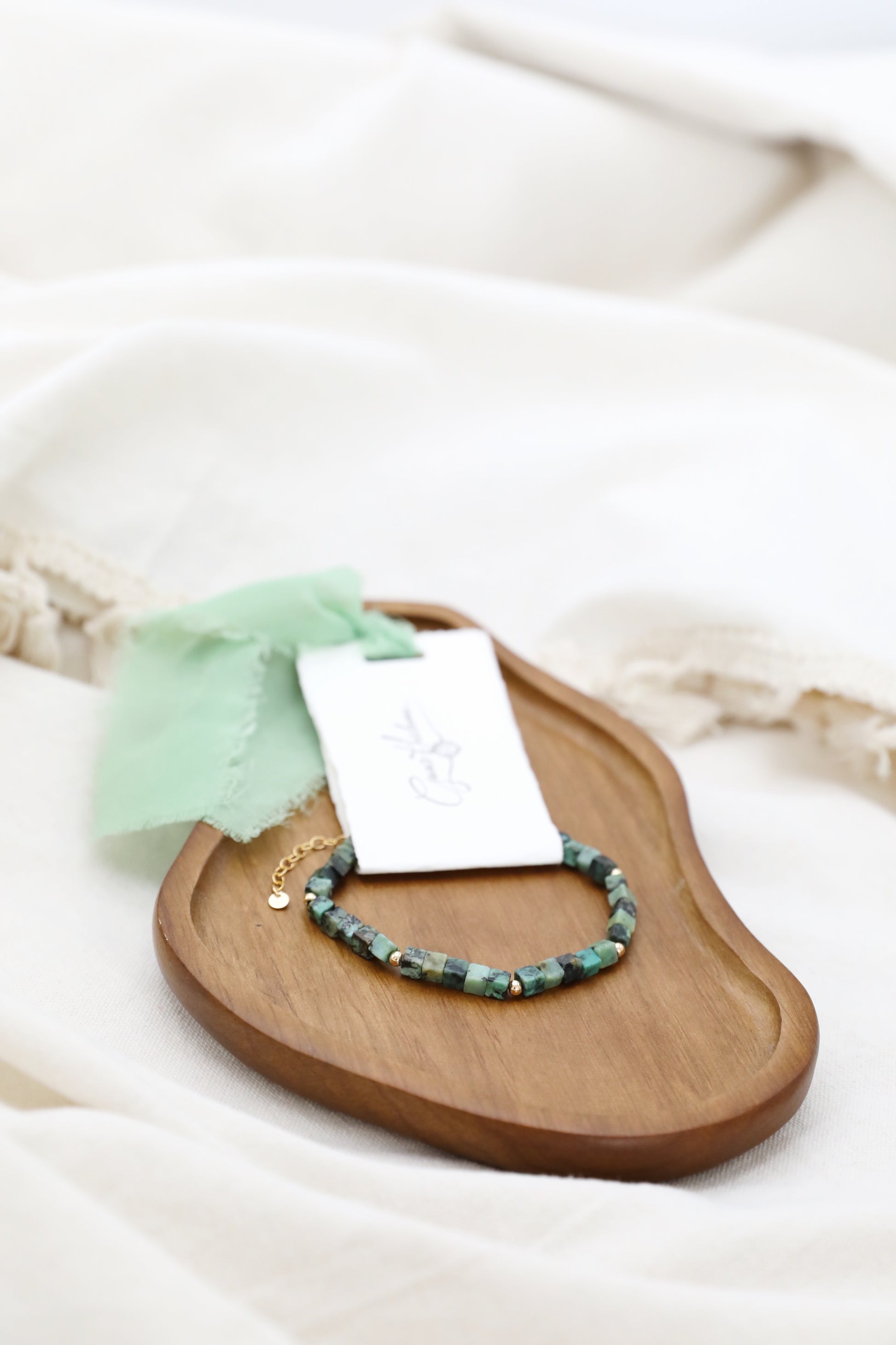 The Voyager's Bracelet by Gaia's Heirlooms, made with square African Turquoise beads and Gold Filled details.